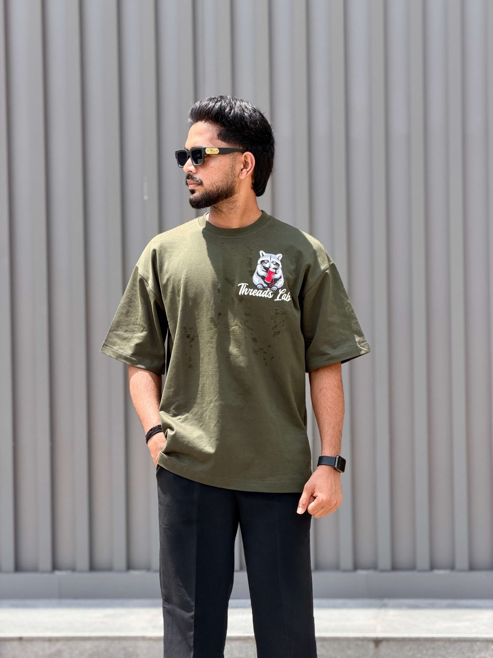 The Ugly Hours typography embroidered on forest green of oversized t-shirt by Threads Lab