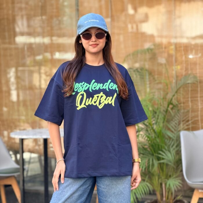 Navy blue oversized t-shirt with green quetzal bird puff embroidery on back