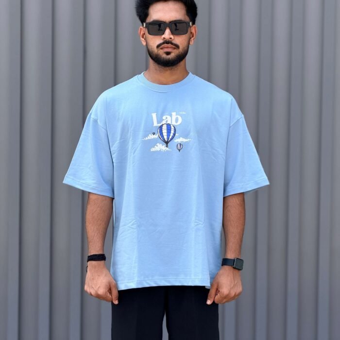 Sky blue oversized t-shirt with hot air balloon and cloud puff embroidery